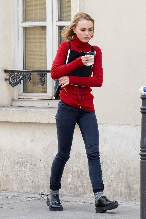 Lily-Rose Depp rocks newspaper print leggings and denim jacket as she picks  up a drink